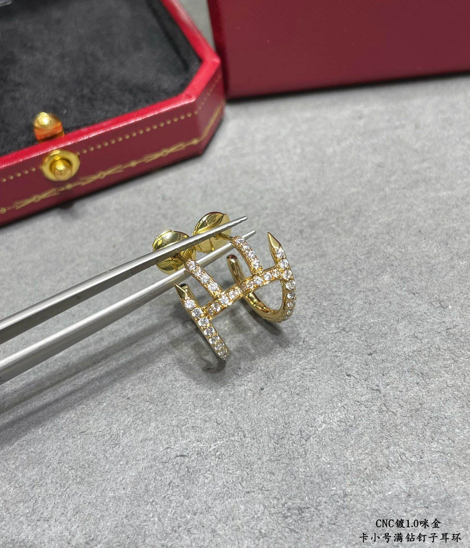 ca*t*er fully Di*m*nd-encrusted small nail earrings