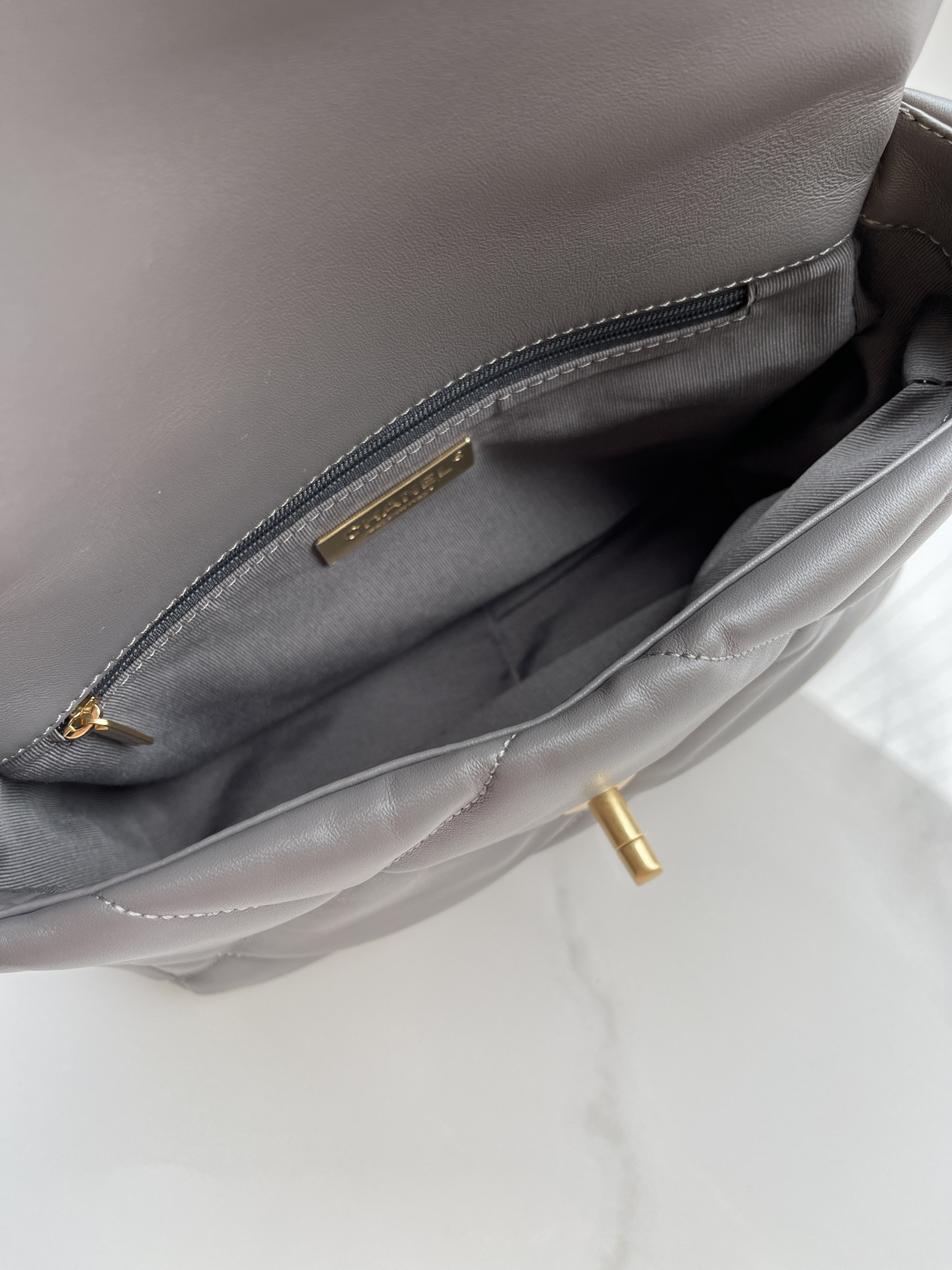 Ch*el 19 handbag shiny leather, gold-tone, silver-tone & ruthenium-finish metal dark gray 6.2 × 10.1 × 3.5 in